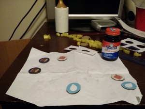 Icons affixed to the chipboard rounds with rubber cement